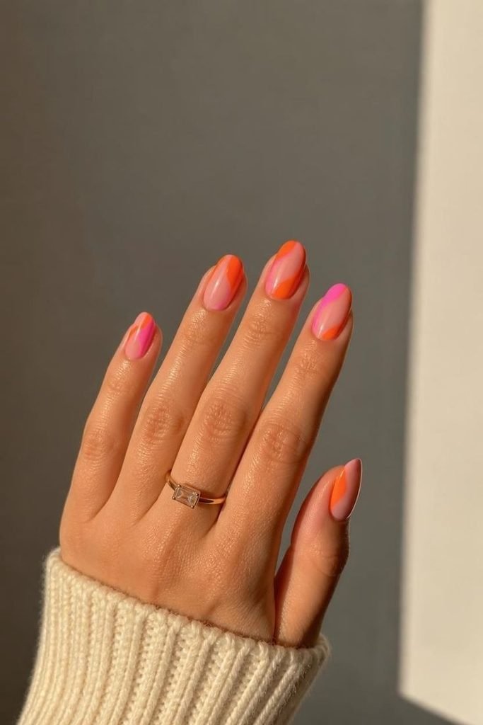 29 Pool Party Nails 2026: Fun, Colorful Designs for Summer Vibes pink-and-orange-nails