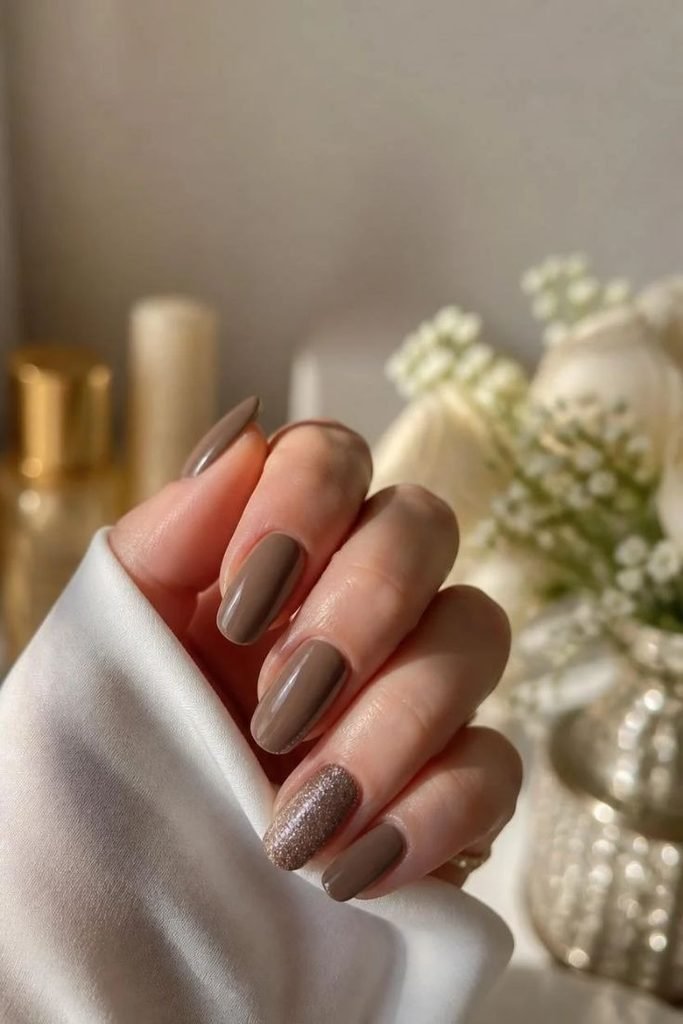 taupe-glitter-accent-nails