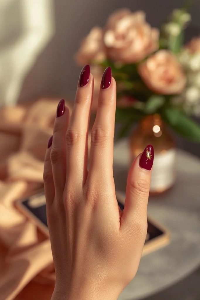 gold-accented-burgundy-nails